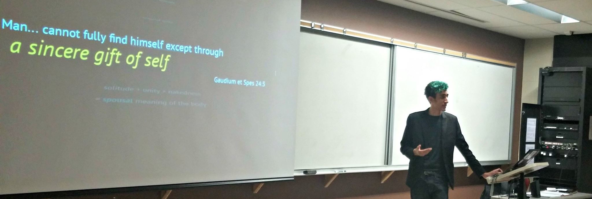 Blaise speaking in a classroom